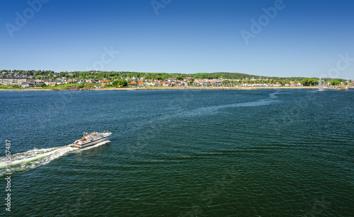 Moss sea bay with motorboat - ferry view