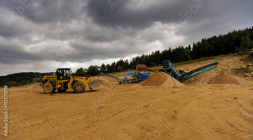 Obraz na płótnie Digger And Conveyor Belt On Construction Site w salonie