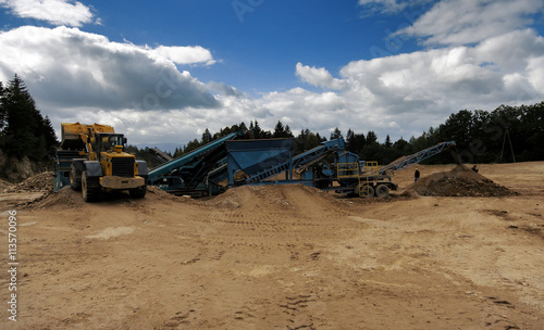 Obraz na płótnie Digger And Conveyor Belt On Construction Site w salonie