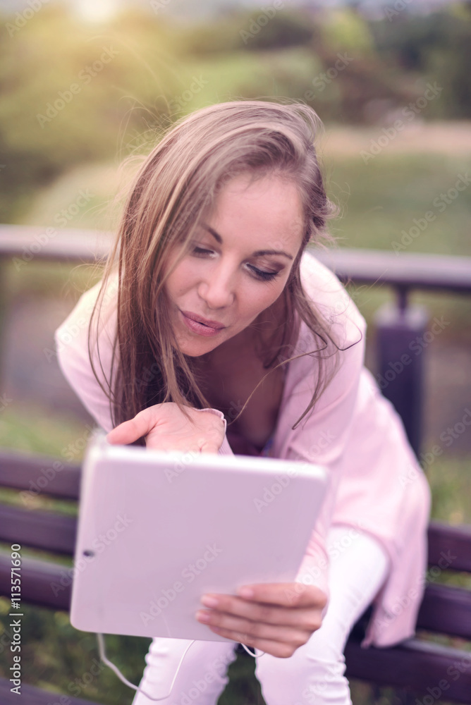 Lovely Girl sending Kiss over Tablet Lovely Girl sending Kiss over Tablet