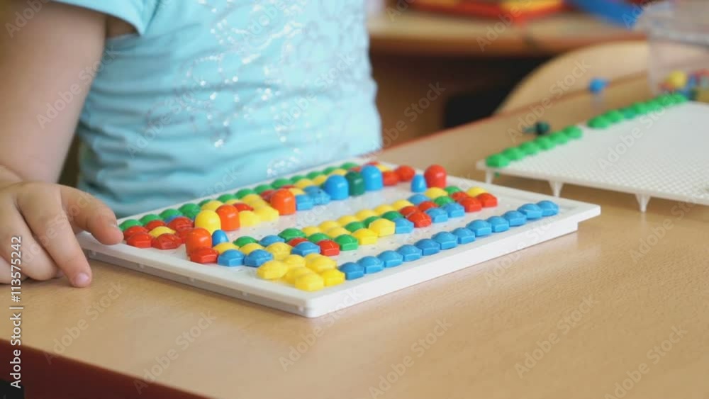 Child plays the intellectual educational game Child plays the intellectual educational game