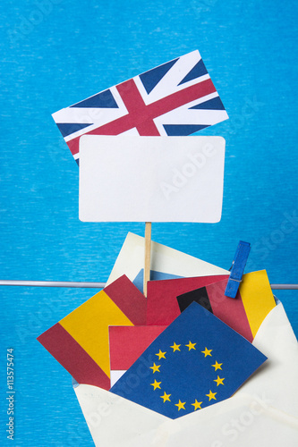 Flags of European Union (flags of different countries  eurozone) and United Kingdom, Brexit UK EU referendum concept. placard for text photo