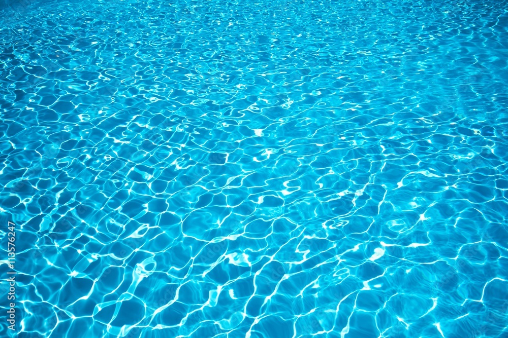 Blue water surface, Ripple Water in swimming pool with sun reflection