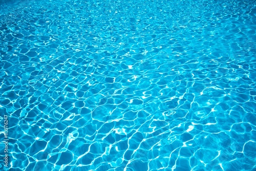 Blue water surface, Ripple Water in swimming pool with sun reflection