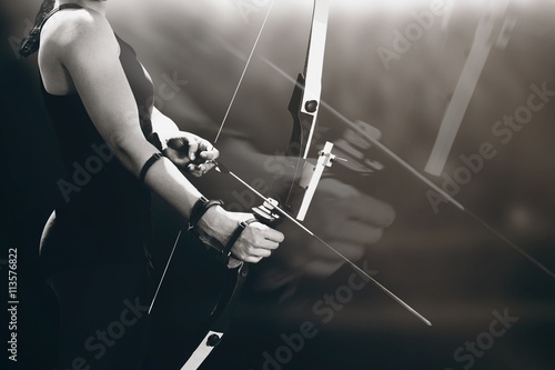 Canvas Print Composite image of sportswoman practicing archery