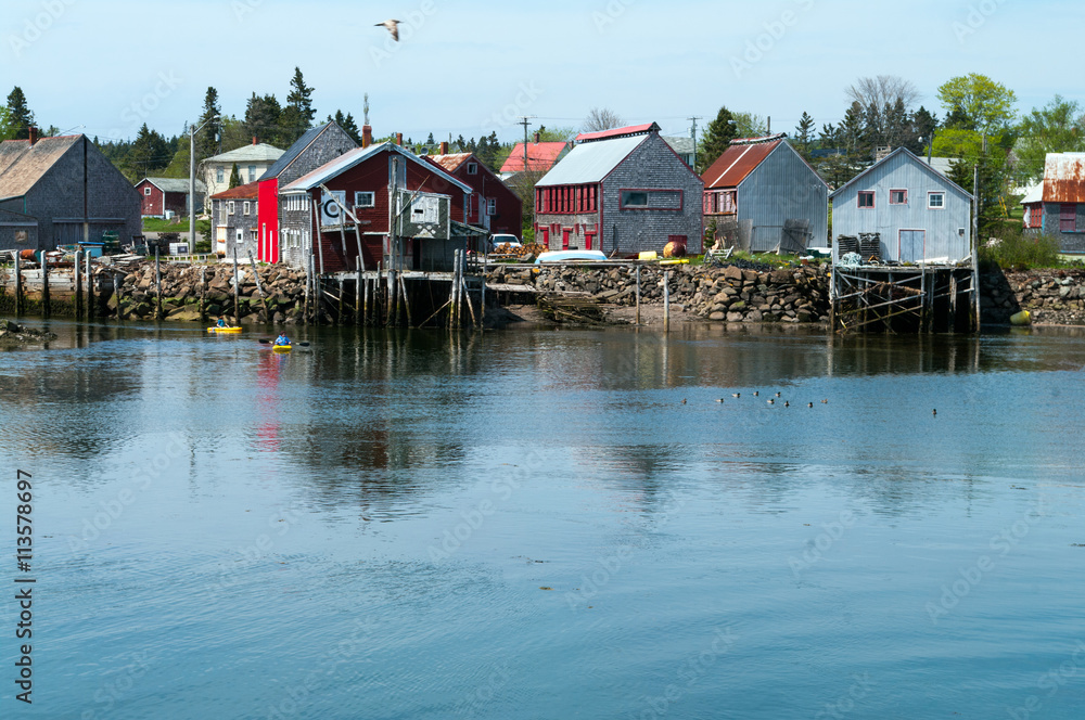 Obraz premium Sea Cove Fish Shed with Kayaks