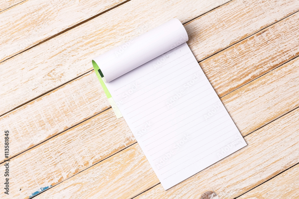 White line paper on wooden table White line paper on wooden table