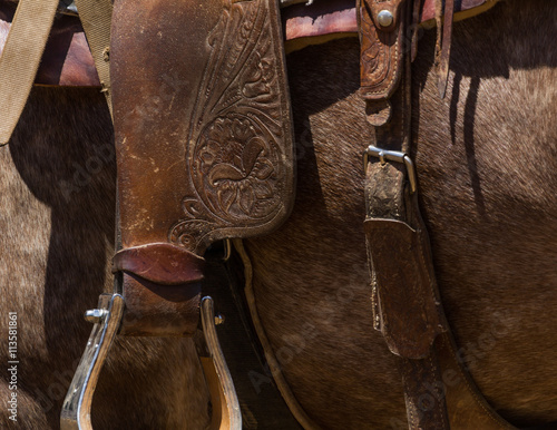 Detail of leather horse rsaddle and riding equipment photo