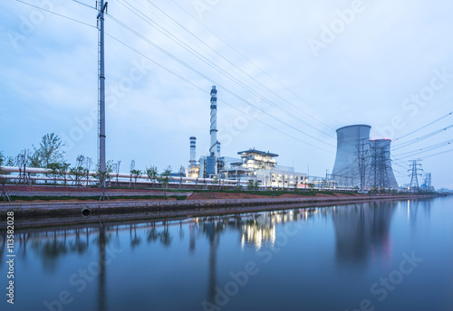 modern power station near river at twilight © zhu difeng