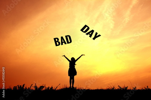 Silhouette children and bad day word at sky sunset