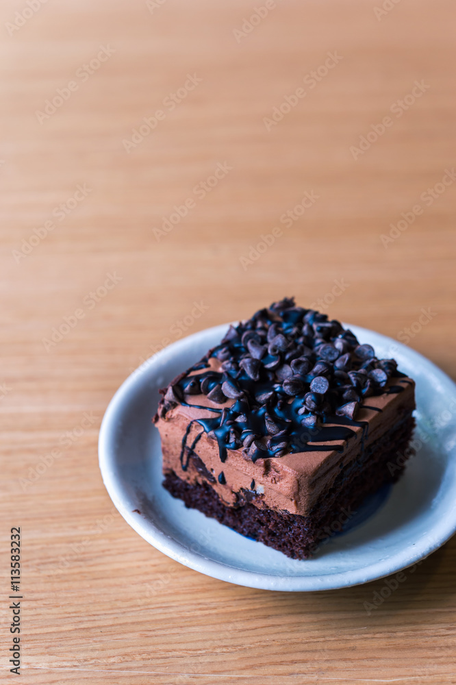 Dark chocolate cake on wood table