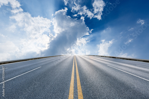 The new asphalt highway is under the blue sky