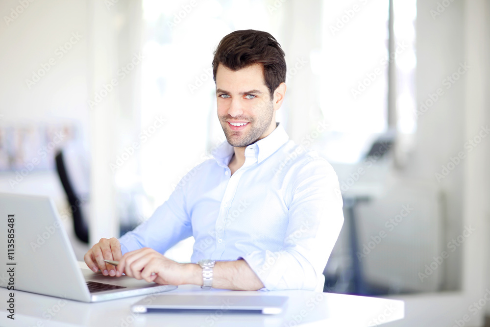 Successful professional man working at office
