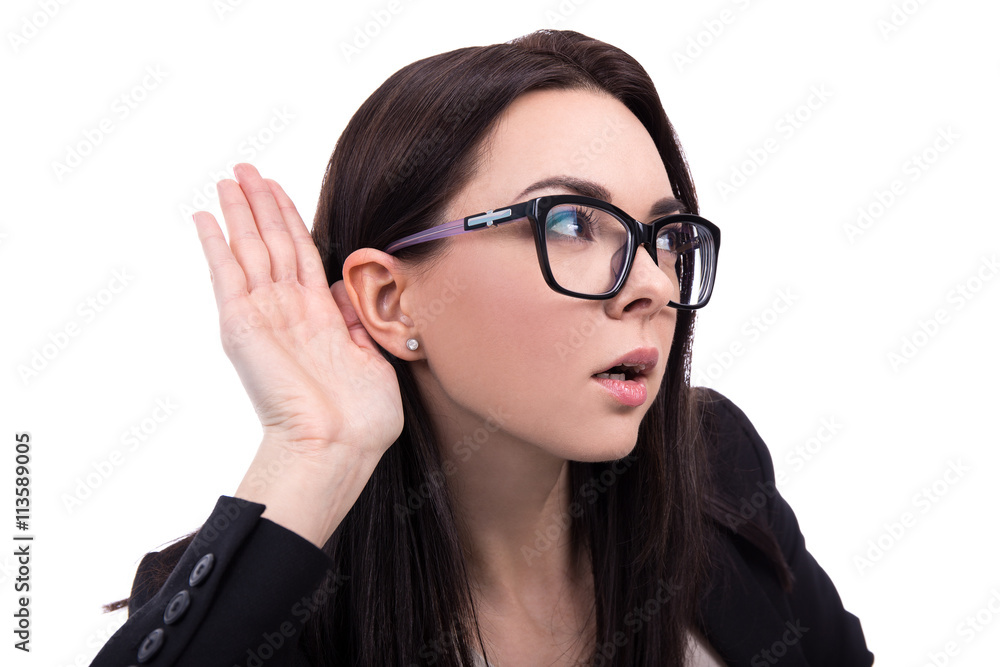 young business woman overhears a conversation isolated on white