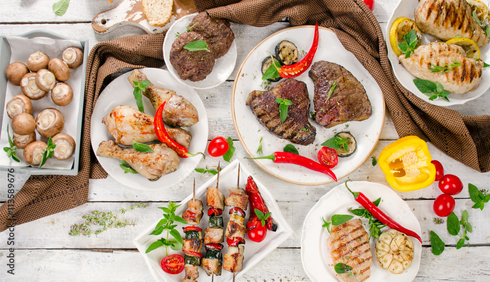 Grilled meats and vegetables on a wooden background. Healthy eat Grilled meats and vegetables on a wooden background. Healthy eat