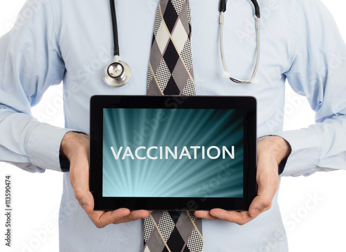 Fotografija Doctor holding tablet - Vaccination