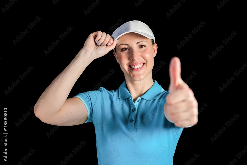 Naklejka premium Sportswoman posing on black background
