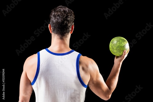 Rear view of male athlete holding ball © WavebreakmediaMicro