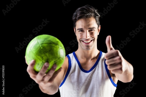 Portrait of happy athlete showing thumbs up