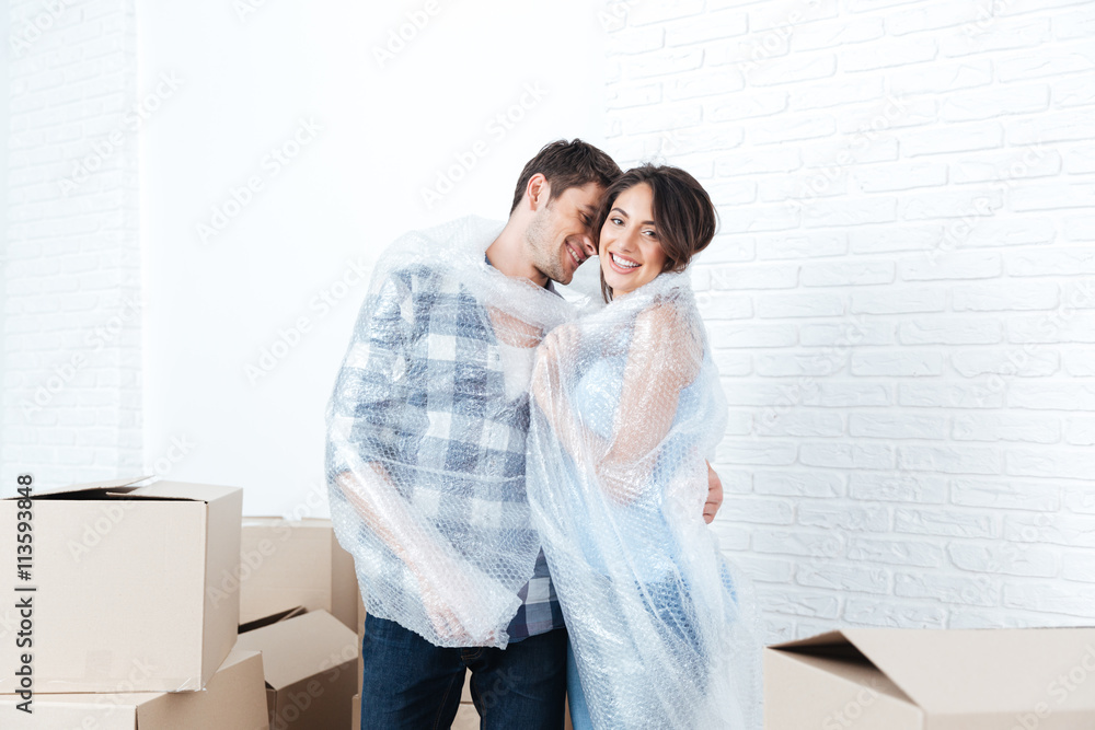 Young pretty couple moving in new flat Young pretty couple moving in new flat