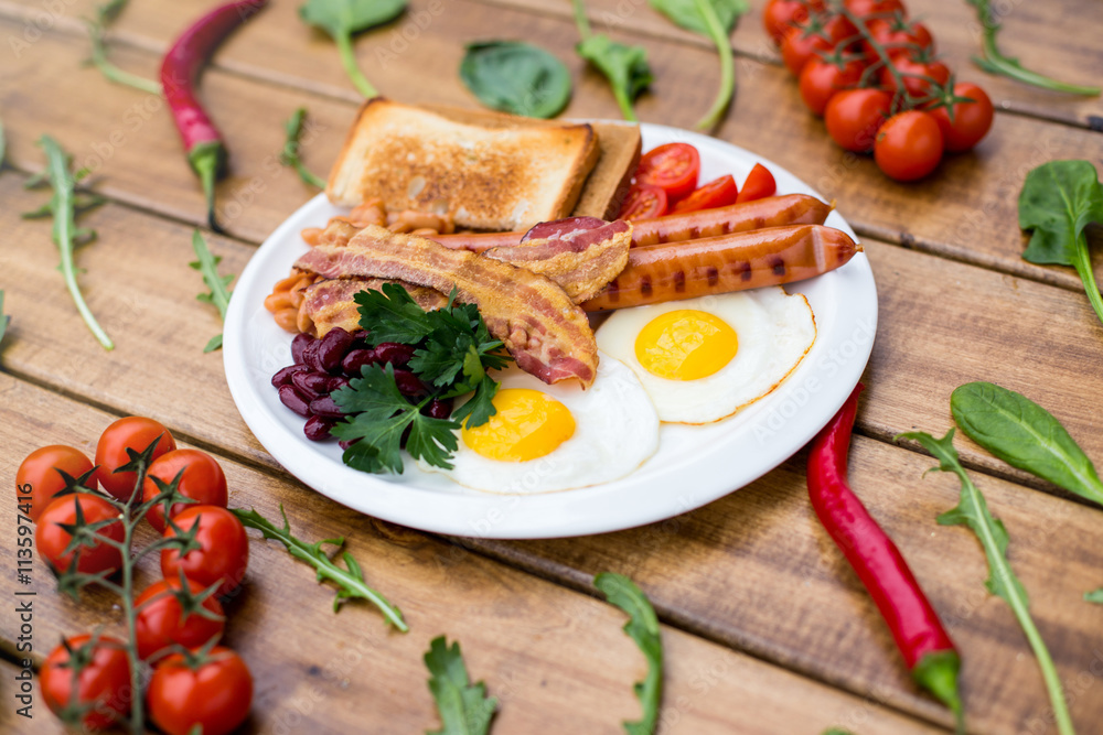 Breakfast, eggs on toast on wood table Breakfast, eggs on toast on wood table