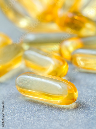 Close up capsules fish oil in Glass bottle .The supplement high