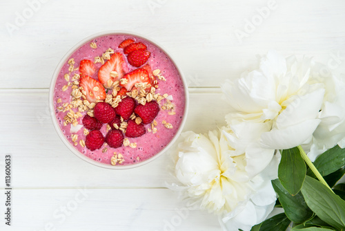 Healthy Pink Smoothie in the Bowl from Banana and Strawberries w