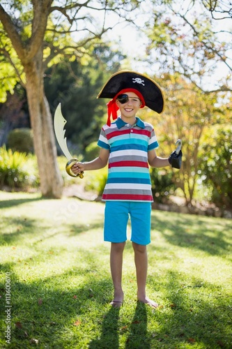 Portrait of boy pretending to be a pirate in the park © WavebreakMediaMicro