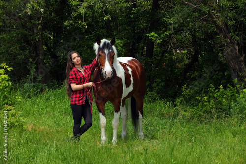 Beautiful girl with a horse in woodland © horsemen