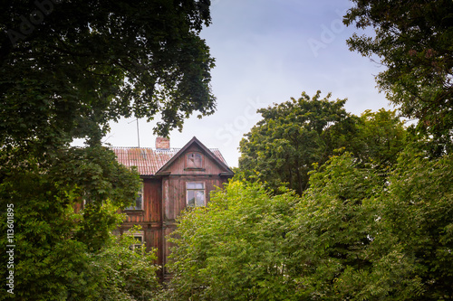 Old Wooden House Behind The Trees © k009034