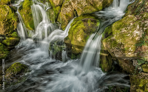 Fototapeta Naklejka Na Ścianę i Meble -  Source of the river that makes waterfalls over rocks