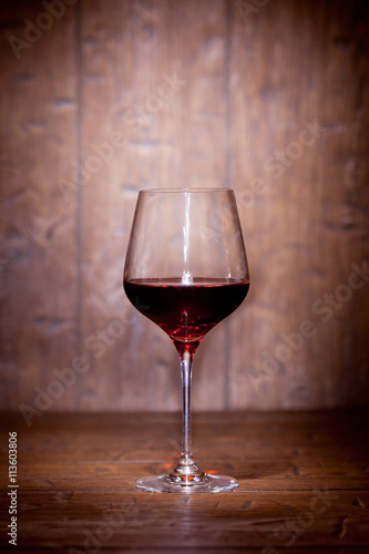 Wine glass on wooden background