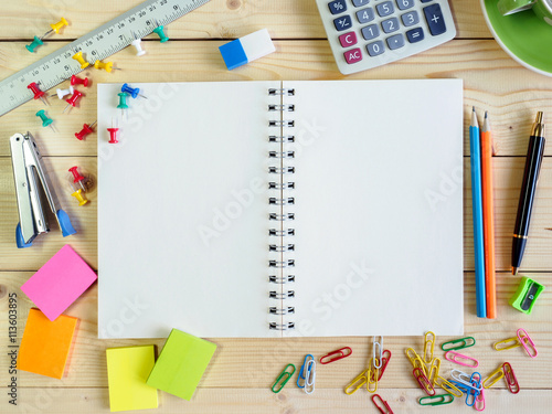 Blank book and stationery on the wooden table
