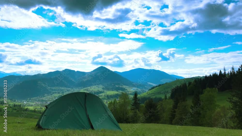 4K .Mountains landscape with tent and clouds. Time lapse without birds, focus change 4K .Mountains landscape with tent and clouds. Time lapse without birds, focus change