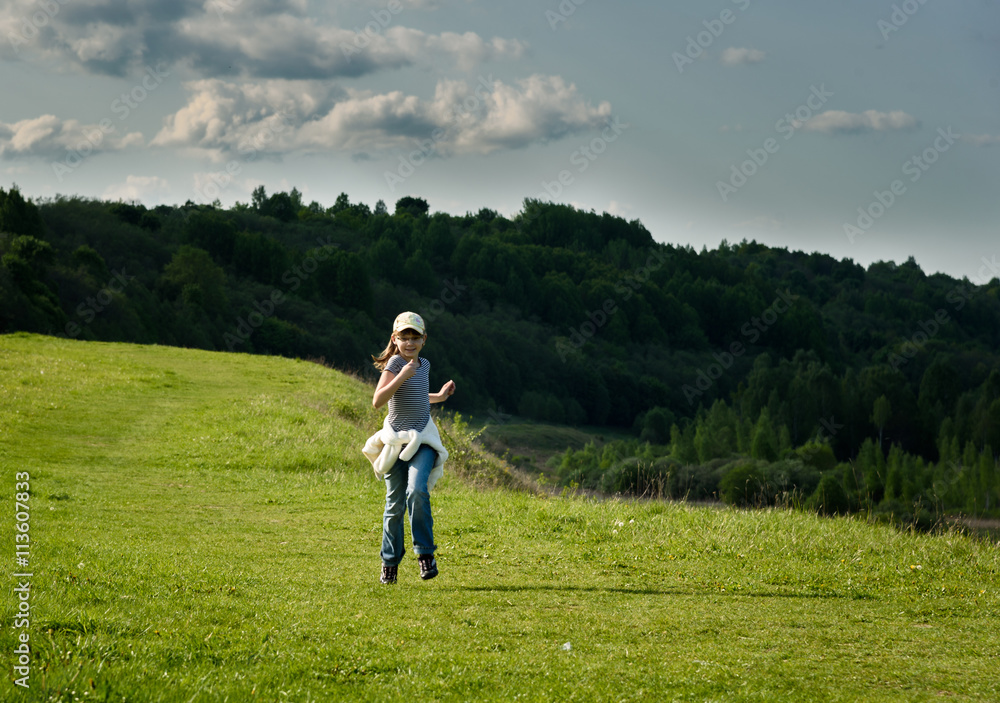 funny baby girl running on green field funny baby girl running on green field