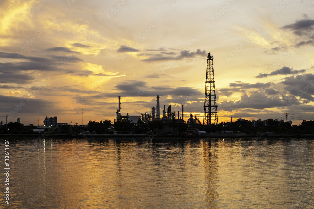 Oil refinery factory during sun rise time in Chao praya river Oil refinery factory during sun rise time in Chao praya river