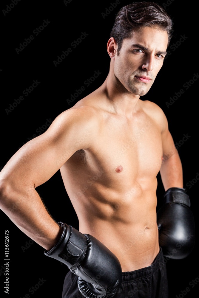 Portrait of boxer standing with boxing gloves