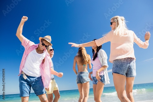  Friends dancing on the beach