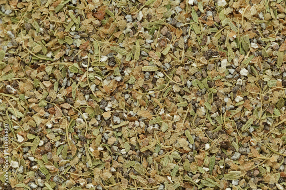 Organic dry True green cardamom (Elettaria cardamomum) tea cut seeds. Macro close up background texture. Top view. Organic dry True green cardamom (Elettaria cardamomum) tea cut seeds. Macro close up background texture. Top view.