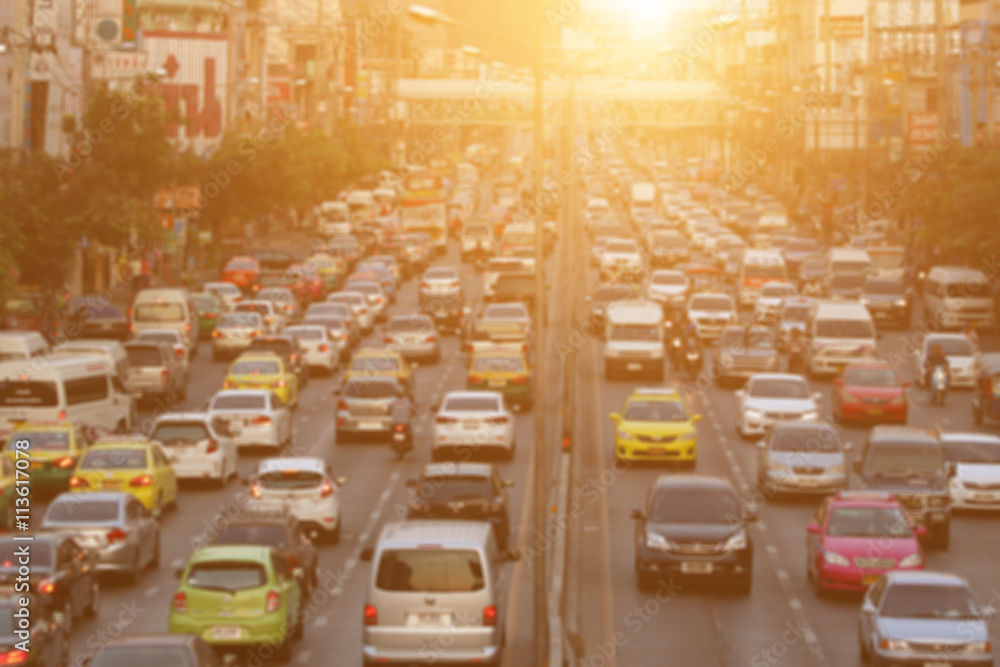 Fototapeta premium blurred traffic jam with sunset light on the road in bangkok ,