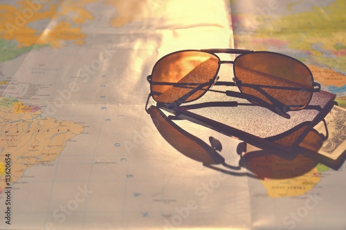 Beautiful concept for summer travel. Sunglasses with passport. Planning a summer vacation and holidays.