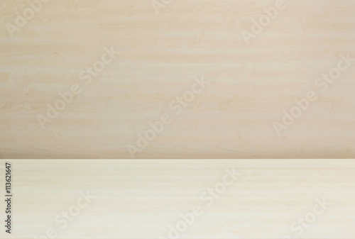 Closeup surface wood pattern at wood desk with blurred wood wall textured background under window light