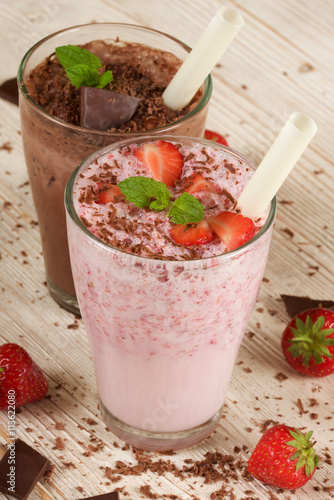 chocolate and strawberry milkshake on wooden background