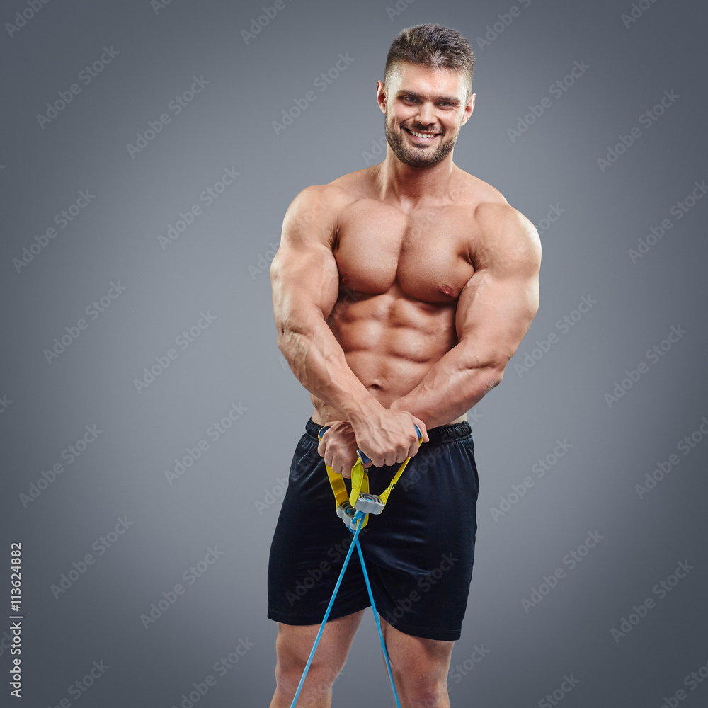 sporty man exercising with rubber expander sporty man exercising with rubber expander