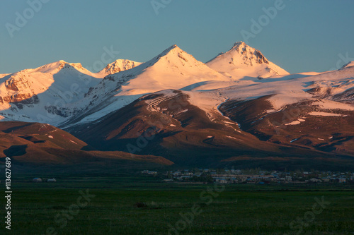 The ray of sunrise in snow-capped mountain of Aragats