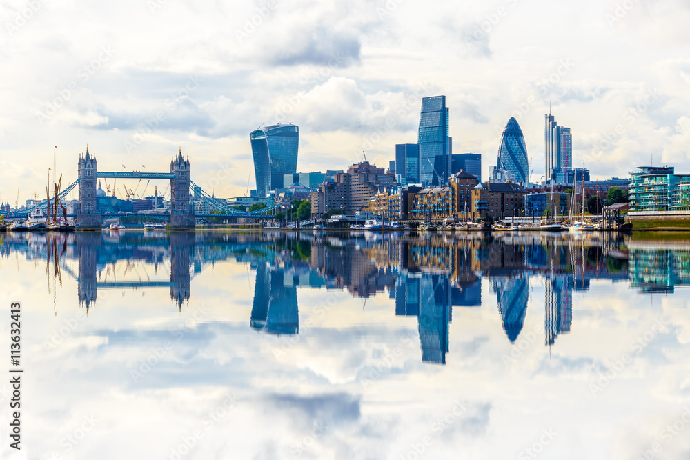 London cityscape with dramatic clouds and the reflection from river Thames