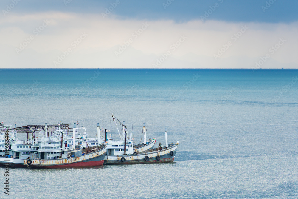Fototapeta premium Fishing boats drop anchor at the harbor.