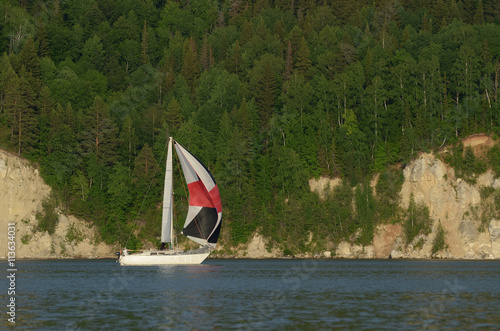 Landscape with a sailing boat.