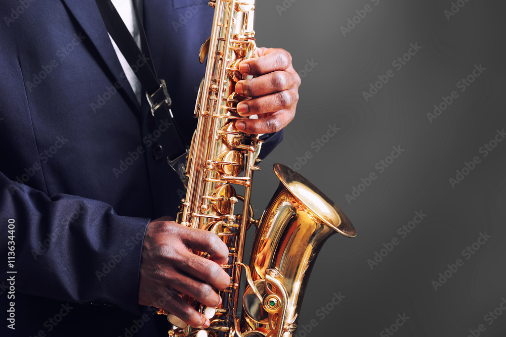 Obraz premium African American jazz musician playing the saxophone, closeup