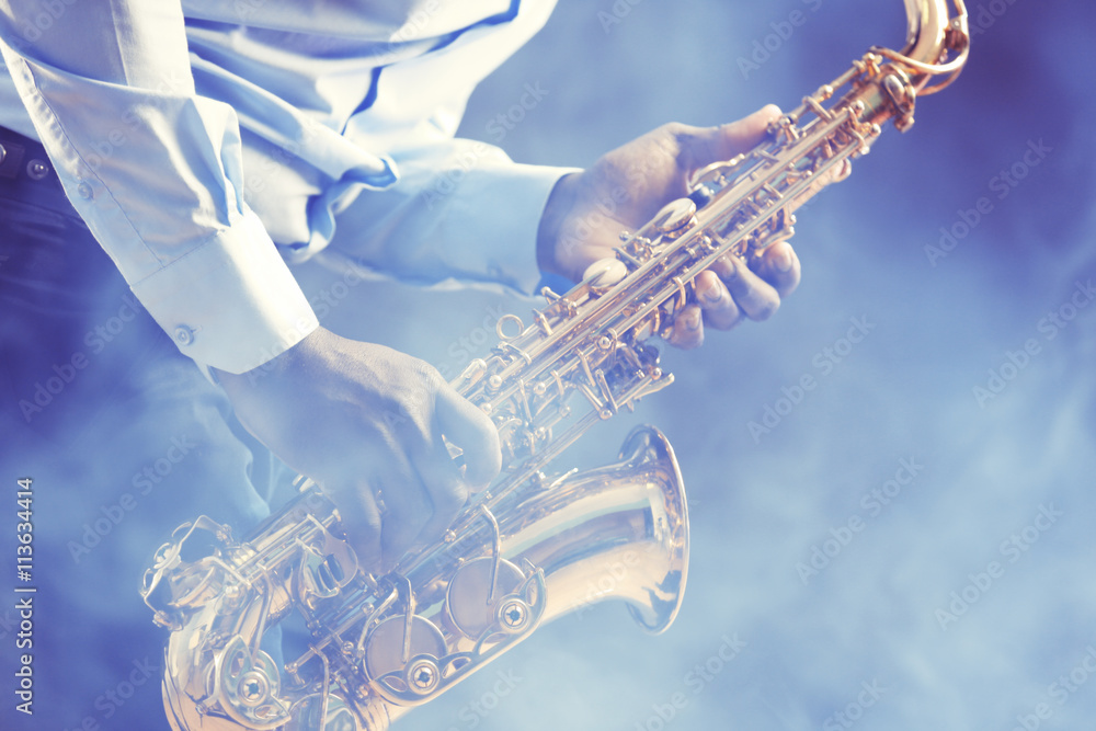 Obraz premium African American jazz musician playing the saxophone, closeup